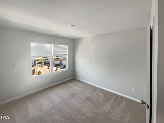 empty room featuring carpet flooring