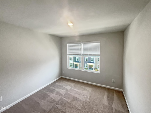 spare room featuring carpet flooring