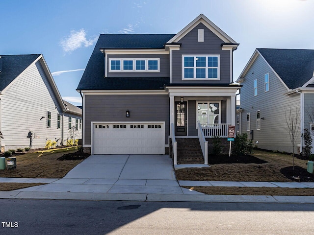 1713 Grassy Falls Ln, Wendell, NC 27591 - view of front of home featuring a porch, a garage, and driveway