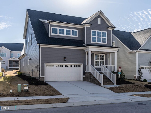 1713 Grassy Falls Ln, Wendell, NC 27591 - view of front of home with a garage, covered porch, and driveway