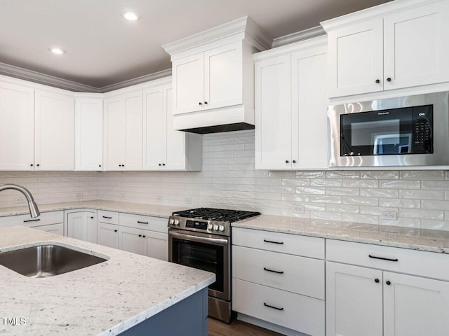 kitchen featuring sink, white cabinets, and stainless steel appliances