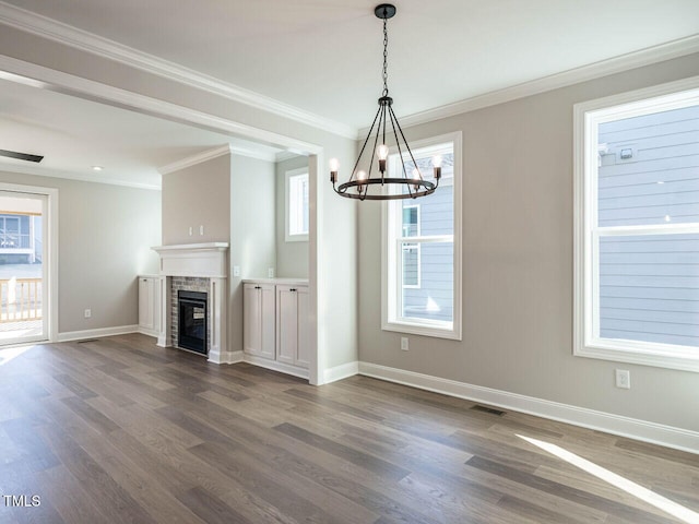 1713 Grassy Falls Ln, Wendell, NC 27591 - unfurnished living room with a chandelier, dark wood finished floors, crown molding, a fireplace, and wine cooler