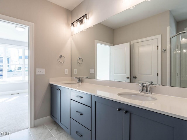 1713 Grassy Falls Ln, Wendell, NC 27591 - full bathroom with double vanity, a shower stall, and marble finish flooring