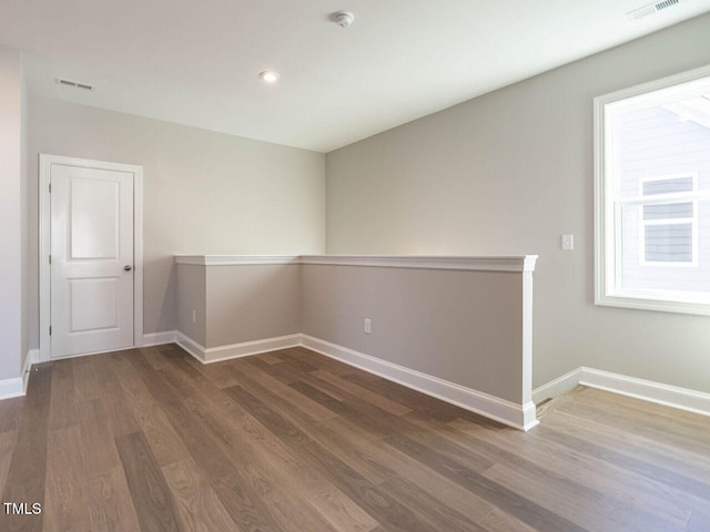 1713 Grassy Falls Ln, Wendell, NC 27591 - spare room featuring a smoke detector, wood finished floors, and recessed lighting