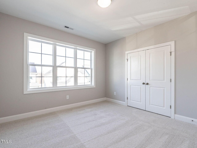 1713 Grassy Falls Ln, Wendell, NC 27591 - unfurnished bedroom with carpet floors and a closet