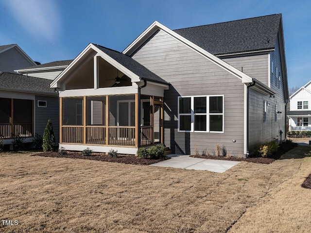 1713 Grassy Falls Ln, Wendell, NC 27591 - rear view of property with ceiling fan, a sunroom, a lawn, and a shingled roof