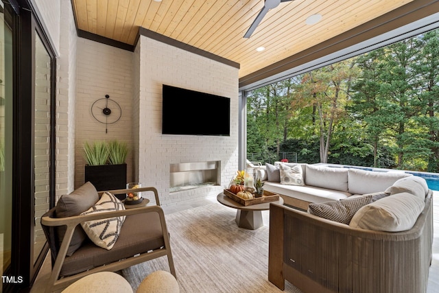 view of patio / terrace featuring an outdoor living space with a fireplace