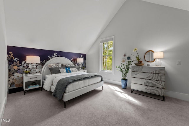 carpeted bedroom featuring lofted ceiling