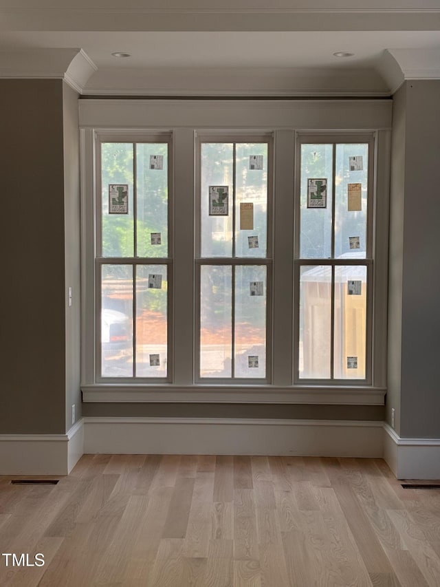 8305 Society Pl, Raleigh, NC 27615 - detailed view of crown molding, wood finished floors, and baseboards