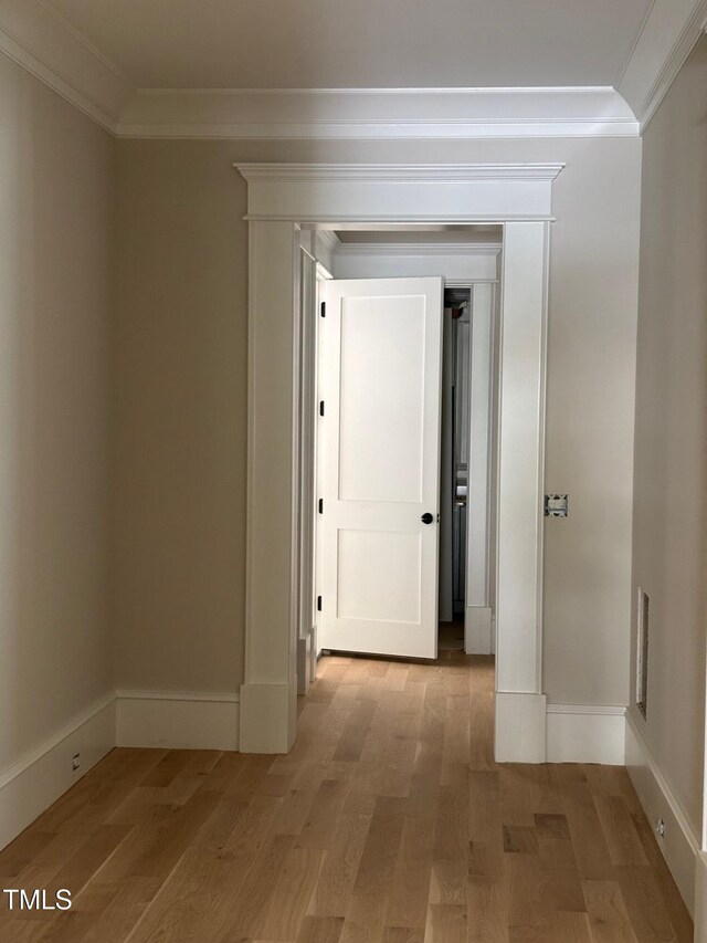 8305 Society Pl, Raleigh, NC 27615 - hall with crown molding, light wood-style flooring, and baseboards