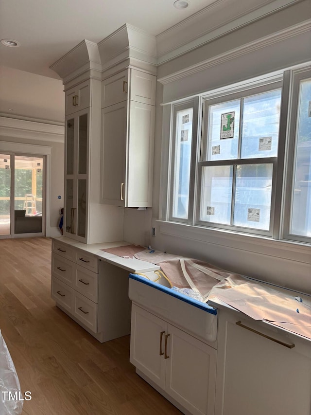 8305 Society Pl, Raleigh, NC 27615 - kitchen featuring light wood-style floors, light countertops, white cabinets, and recessed lighting