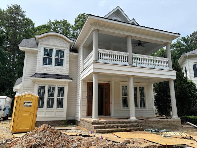 8305 Society Pl, Raleigh, NC 27615 - view of front of house featuring a balcony, covered porch, a standing seam roof, a ceiling fan, and metal roof