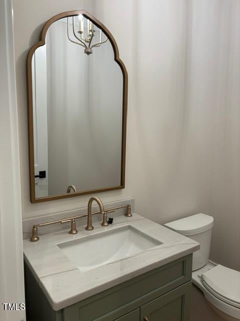 8305 Society Pl, Raleigh, NC 27615 - half bathroom with vanity and toilet