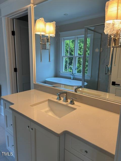 8305 Society Pl, Raleigh, NC 27615 - full bath with a freestanding tub, a shower stall, and vanity