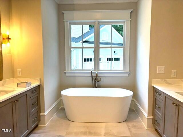 8305 Society Pl, Raleigh, NC 27615 - bathroom with vanity and a freestanding bath