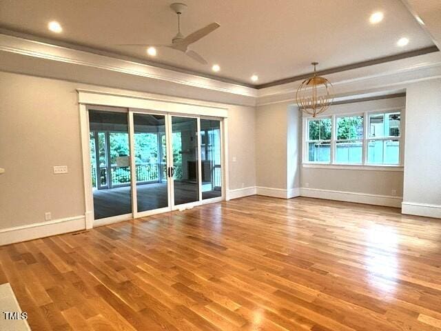 8305 Society Pl, Raleigh, NC 27615 - empty room with a ceiling fan, ornamental molding, wood finished floors, and recessed lighting