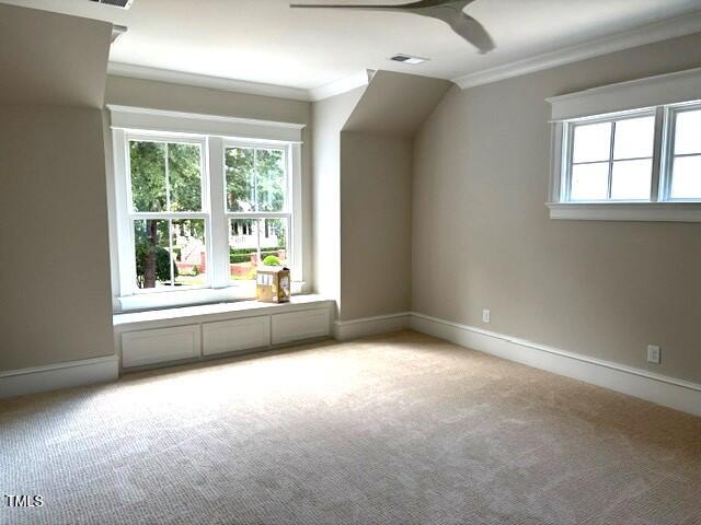 8305 Society Pl, Raleigh, NC 27615 - bonus room featuring healthy amount of natural light, a ceiling fan, and light colored carpet