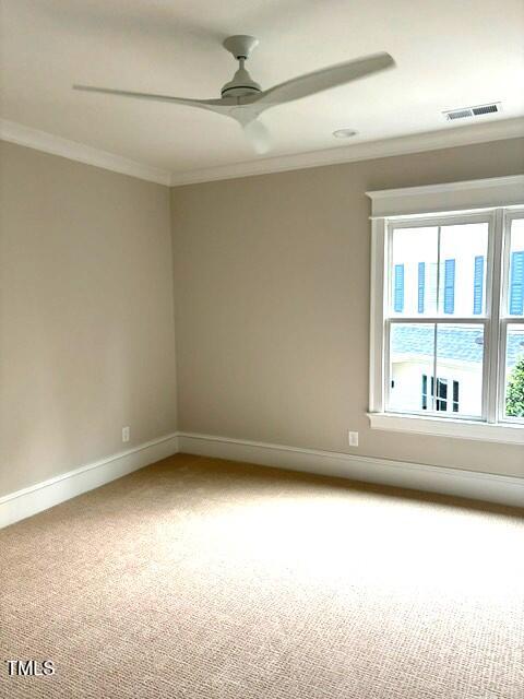 8305 Society Pl, Raleigh, NC 27615 - carpeted spare room with ornamental molding and a ceiling fan