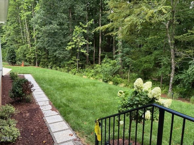 8305 Society Pl, Raleigh, NC 27615 - view of green lawn featuring a forest view