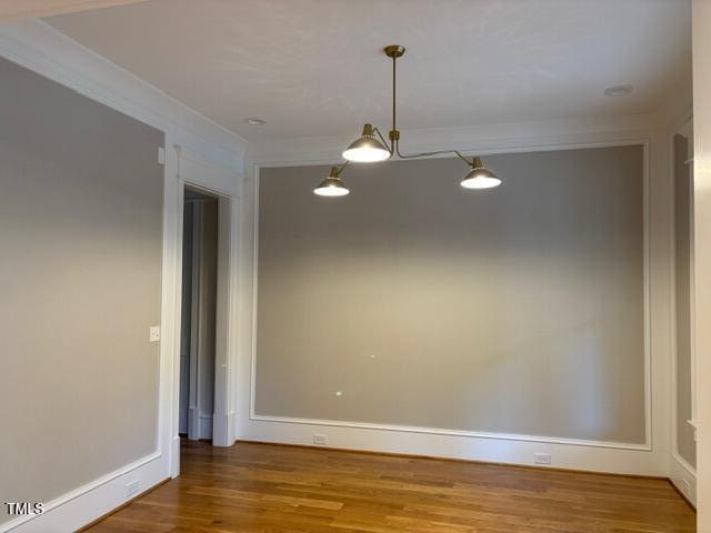 8305 Society Pl, Raleigh, NC 27615 - empty room featuring wood finished floors and ornamental molding
