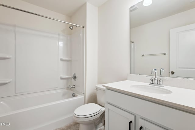 bathroom featuring vanity, washtub / shower combination, and toilet