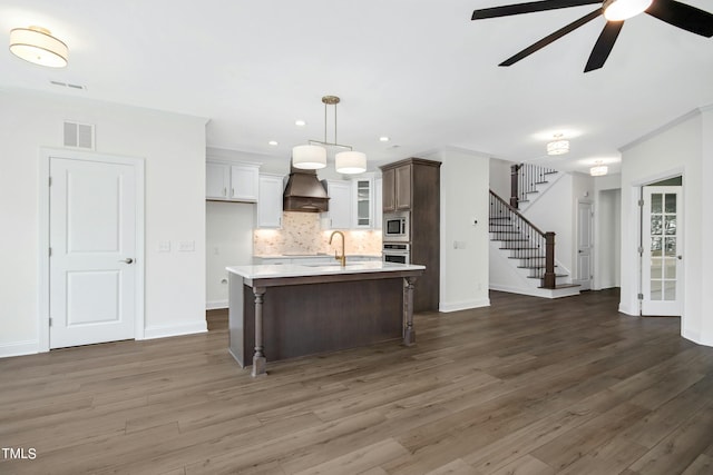 kitchen featuring white cabinets, dark hardwood / wood-style floors, and ceiling fan