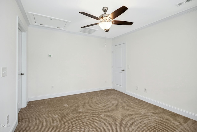 carpeted spare room featuring ceiling fan and ornamental molding