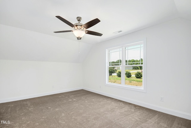 additional living space with ceiling fan, carpet floors, and lofted ceiling