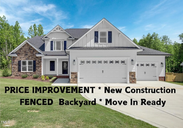 craftsman house featuring a garage and a front lawn