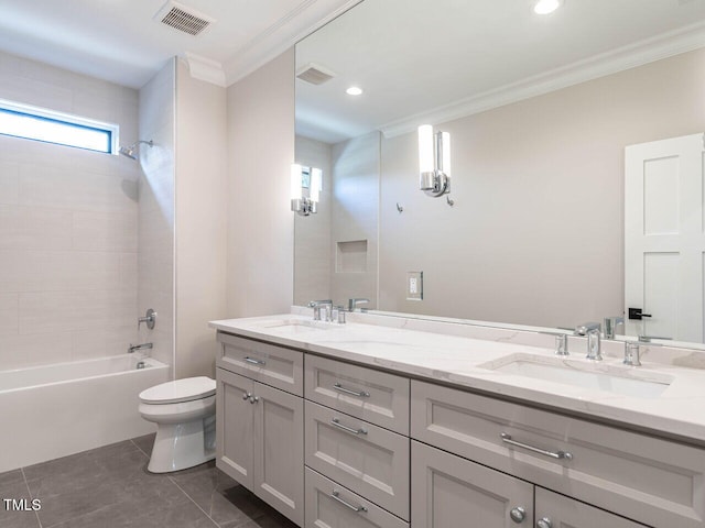 full bathroom featuring toilet, ornamental molding, vanity, tiled shower / bath combo, and tile patterned flooring