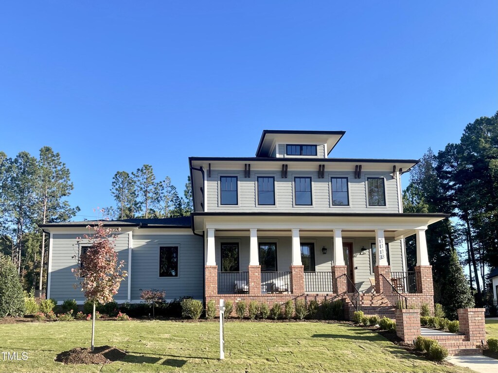 1113 Destination Dr, Apex, NC 27523 - view of front of home featuring a porch and a front yard