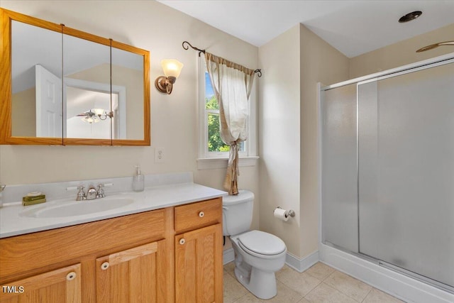 full bathroom featuring tile patterned flooring, a stall shower, toilet, and vanity