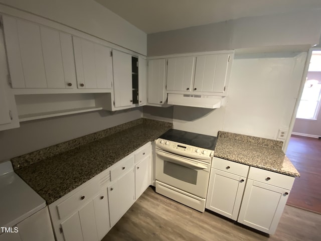 kitchen with hardwood / wood-style flooring, white cabinetry, white electric stove, and washer / clothes dryer