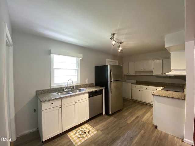 kitchen featuring white cabinetry, sink, dark wood-type flooring, light stone counters, and appliances with stainless steel finishes