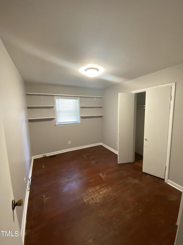 unfurnished bedroom with a closet