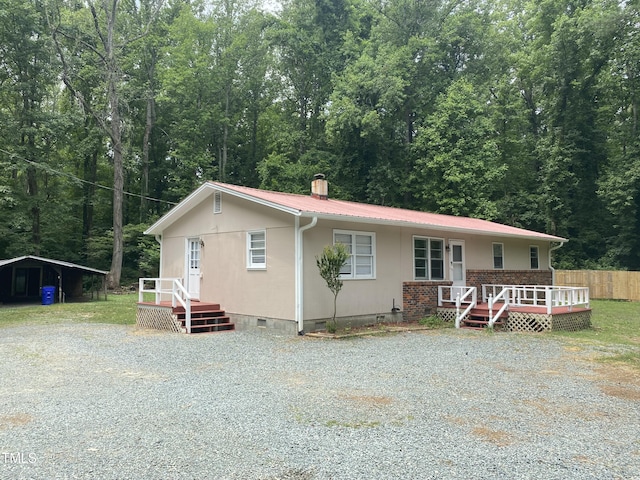 view of front of home with a wooden deck