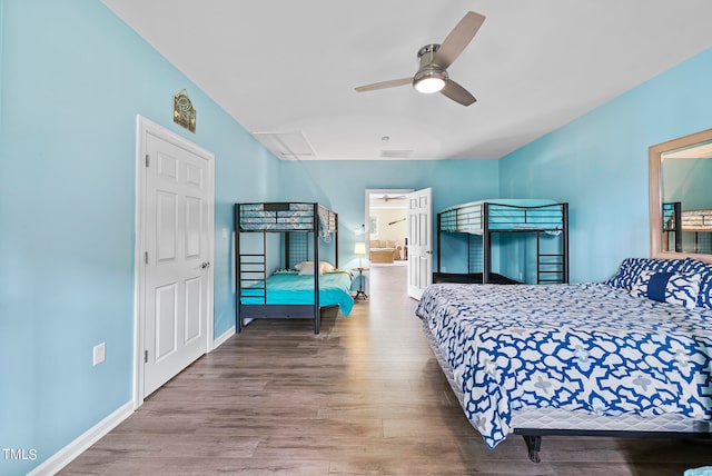 bedroom with hardwood / wood-style flooring and ceiling fan