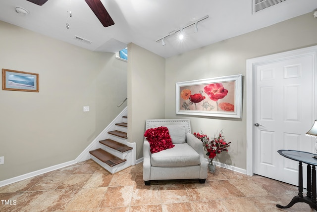 sitting room with tile floors, ceiling fan, and rail lighting