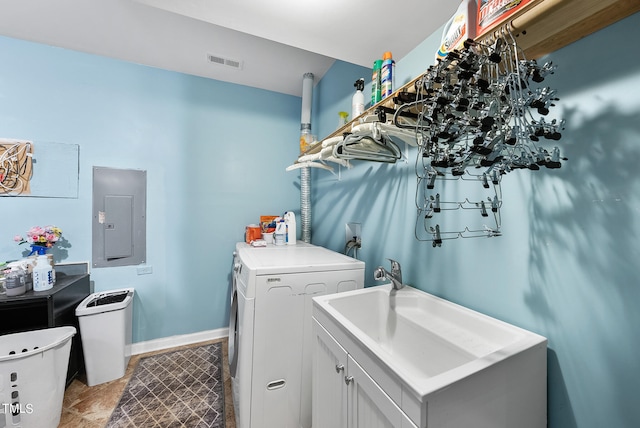 washroom with cabinets, tile flooring, hookup for a washing machine, independent washer and dryer, and sink