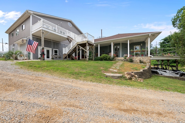 rear view of house with covered porch