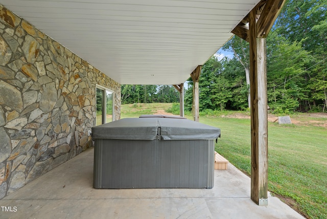 view of terrace featuring a hot tub