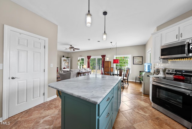 kitchen with stainless steel appliances, decorative light fixtures, backsplash, light tile floors, and white cabinets