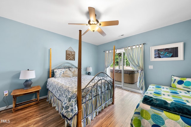 bedroom with ceiling fan and hardwood / wood-style flooring