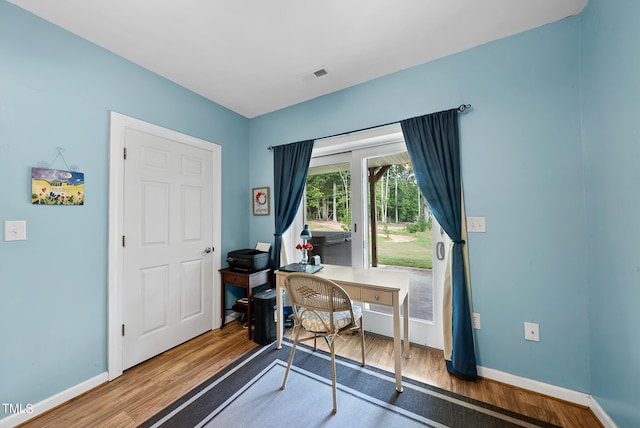 office with hardwood / wood-style flooring