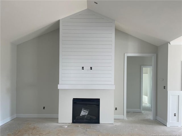 unfurnished living room with lofted ceiling