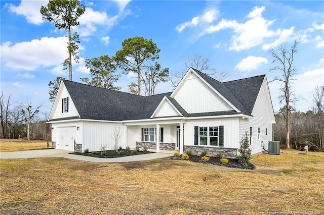 view of front of property with cooling unit, covered porch, and a front lawn