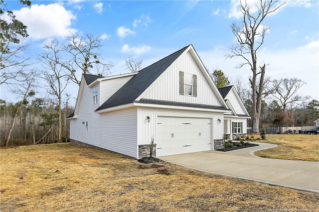 view of property exterior with a garage and a lawn