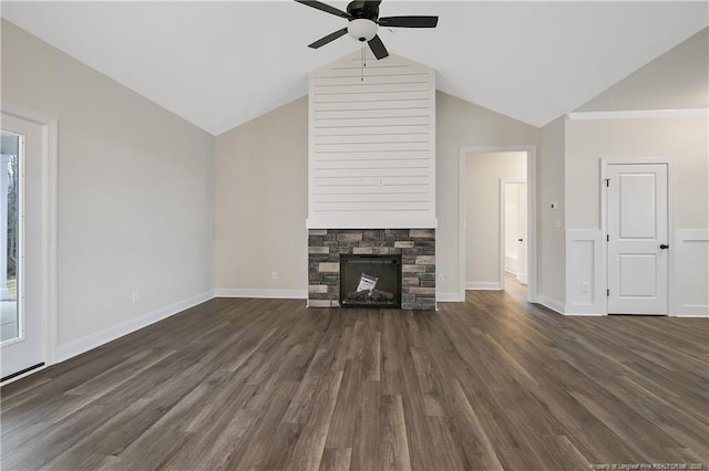 unfurnished living room featuring dark hardwood / wood-style floors, ceiling fan, a fireplace, and vaulted ceiling