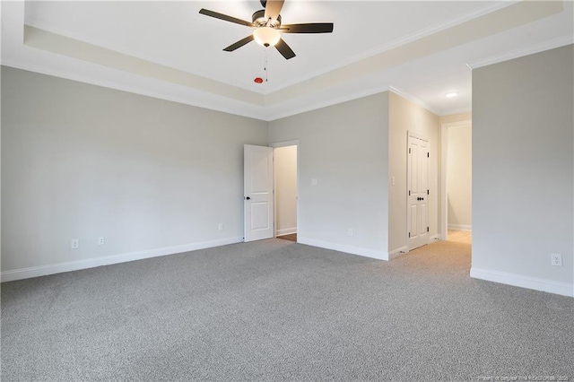 empty room featuring crown molding, carpet floors, and ceiling fan