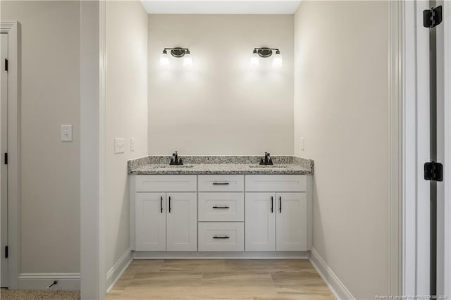 bathroom featuring vanity and hardwood / wood-style floors